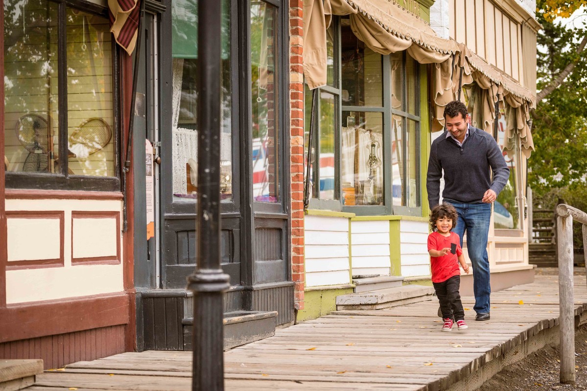 dad chasing son on platform at Heritage Park